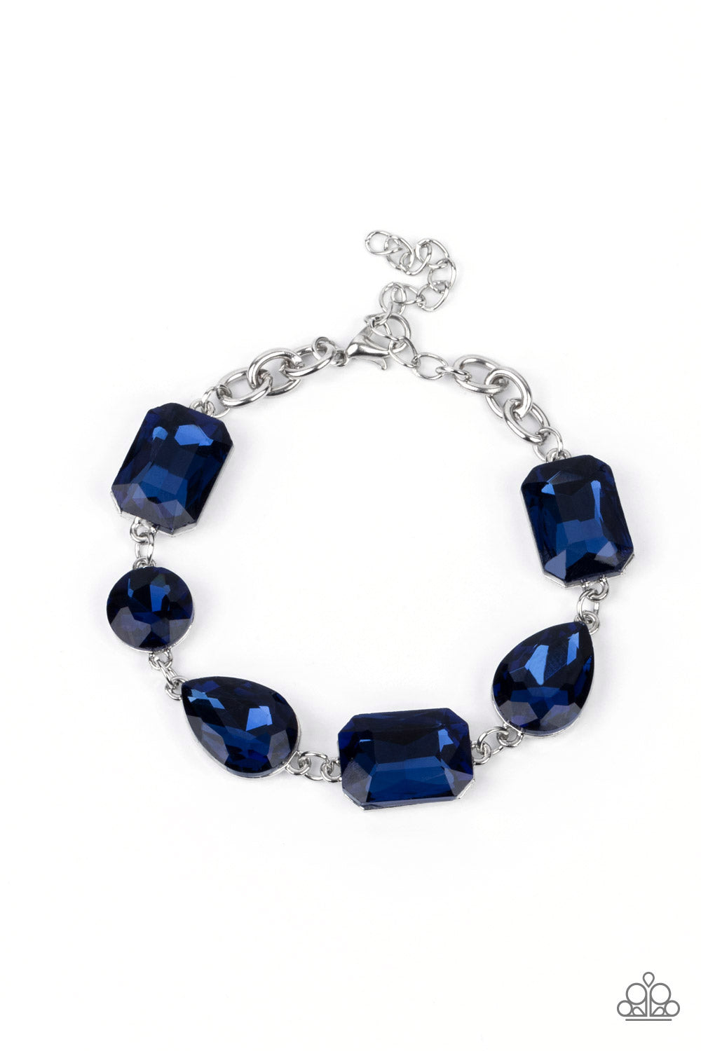 Cosmic Treasure Chest Blue Bracelet - Paparazzi Accessories  A collection of oversized round, teardrop, and emerald cut blue rhinestones delicately link around the wrist, creating a blinding statement piece. Features an adjustable clasp closure.  All Paparazzi Accessories are lead free and nickel free!  Sold as one individual bracelet.