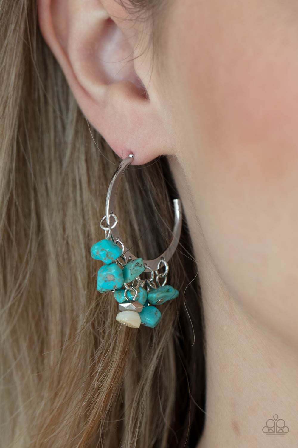 Gorgeously Grounding Blue Earring - Paparazzi Accessories  Clusters of turquoise pebbles swing from the bottom of a dainty silver hoop, creating an earthy fringe. A faceted silver and white stone bead swings from the center, adding an ethereal edge. Earring attaches to a standard post fitting. Hoop measures approximately 1 1/4" in diameter.  All Paparazzi Accessories are lead free and nickel free!  Sold as one pair of hoop earrings.