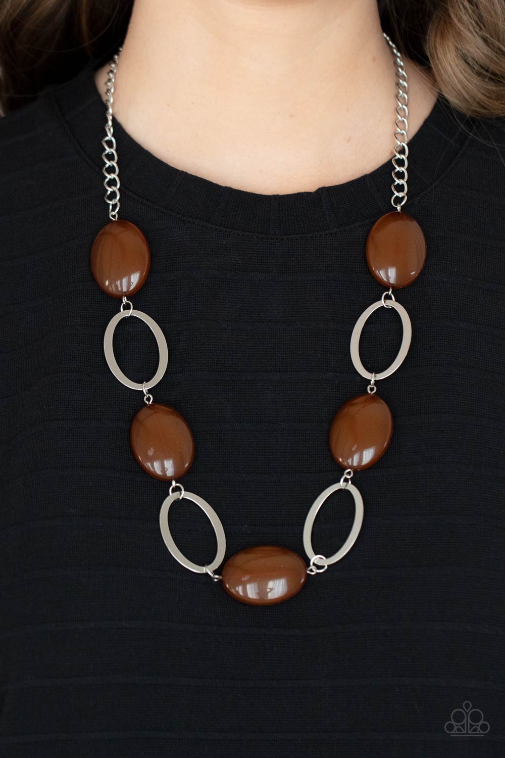 Beachside Boardwalk Brown Necklace - Paparazzi Accessories  Shiny silver ovals and glassy brown oval beads delicately link across the chest, creating a whimsical pop of color. Features an adjustable clasp closure.  All Paparazzi Accessories are lead free and nickel free!  Sold as one individual necklace. Includes one pair of matching earrings.