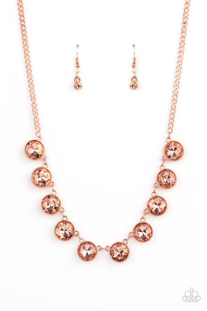 Mystical Majesty Copper Necklace - Paparazzi Accessories  Featuring a mystical iridescence, a sparkling display of round cut coppery gems are encased in delicately textured copper frames as they link below the collar, creating a majestic statement piece. Features an adjustable clasp closure.  All Paparazzi Accessories are lead free and nickel free!  Sold as one individual necklace. Includes one pair of matching earrings.