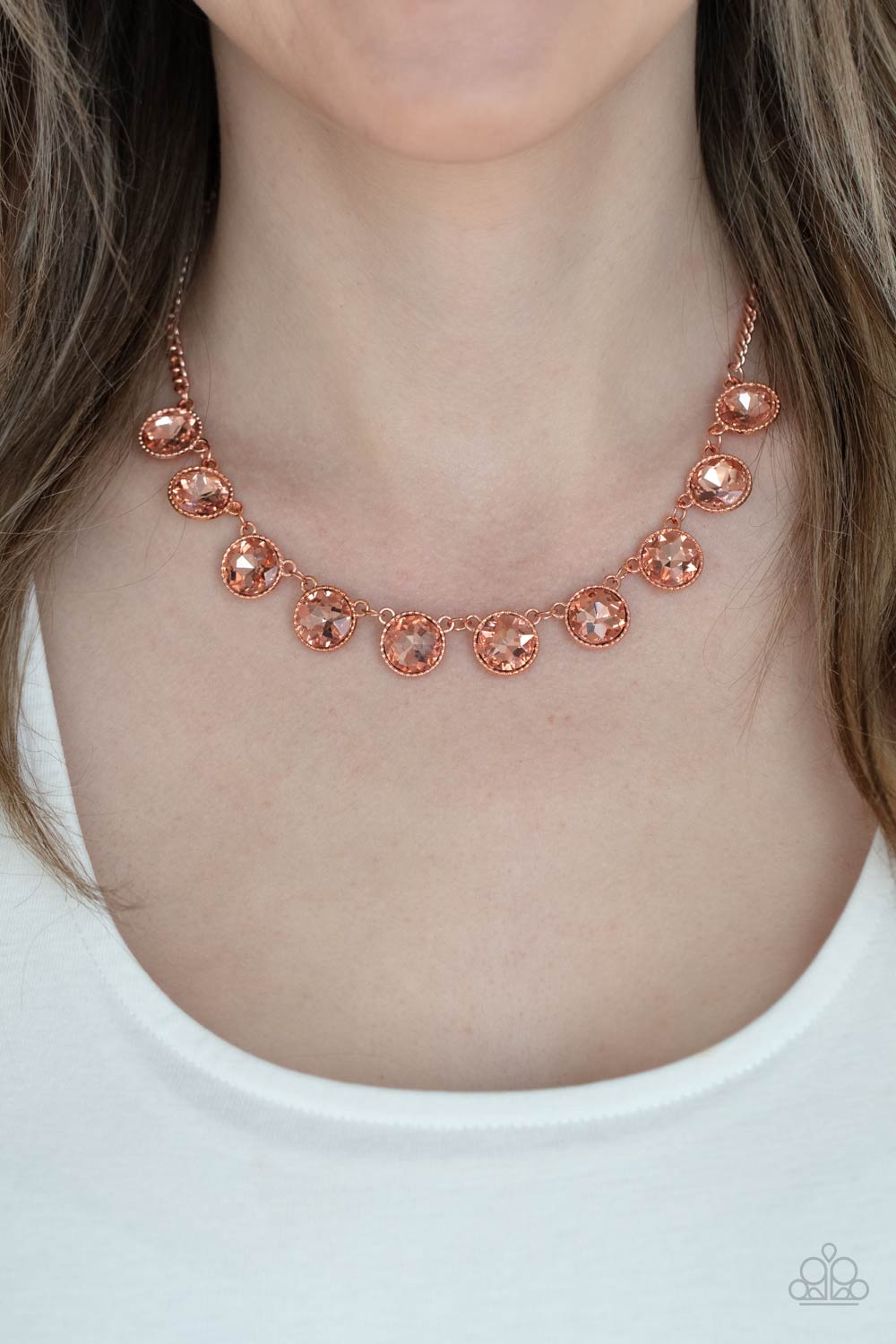 Mystical Majesty Copper Necklace - Paparazzi Accessories  Featuring a mystical iridescence, a sparkling display of round cut coppery gems are encased in delicately textured copper frames as they link below the collar, creating a majestic statement piece. Features an adjustable clasp closure.  All Paparazzi Accessories are lead free and nickel free!  Sold as one individual necklace. Includes one pair of matching earrings.