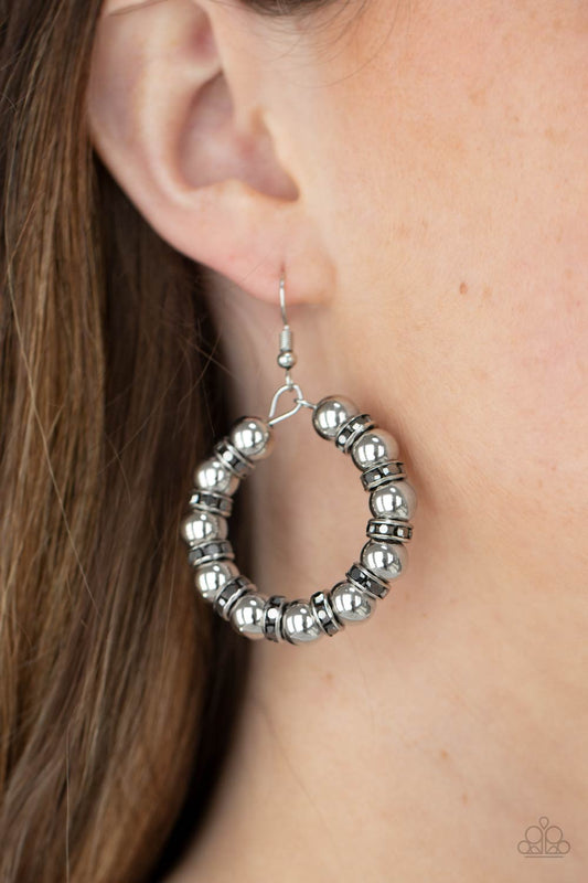 Cosmic Halo Silver Earring - Paparazzi Accessories  Glistening silver beads and iridescent hematite encrusted rings alternate along a dainty wire hoop, creating a glamorous display. Earring attaches to a standard fishhook fitting.  All Paparazzi Accessories are lead free and nickel free!  Sold as one pair of earrings.