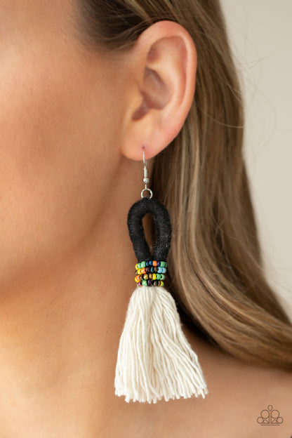 The Dustup Black Earring - Paparazzi Accessories  A tassel of soft white cotton fans out under rows of brightly colored seed beads. Anchored by a loop of jet black floss, the eye-catching style swings from the ear for a show-stopping statement. Earring attaches to a standard fishhook fitting.  All Paparazzi Accessories are lead free and nickel free!  Sold as one pair of earrings.