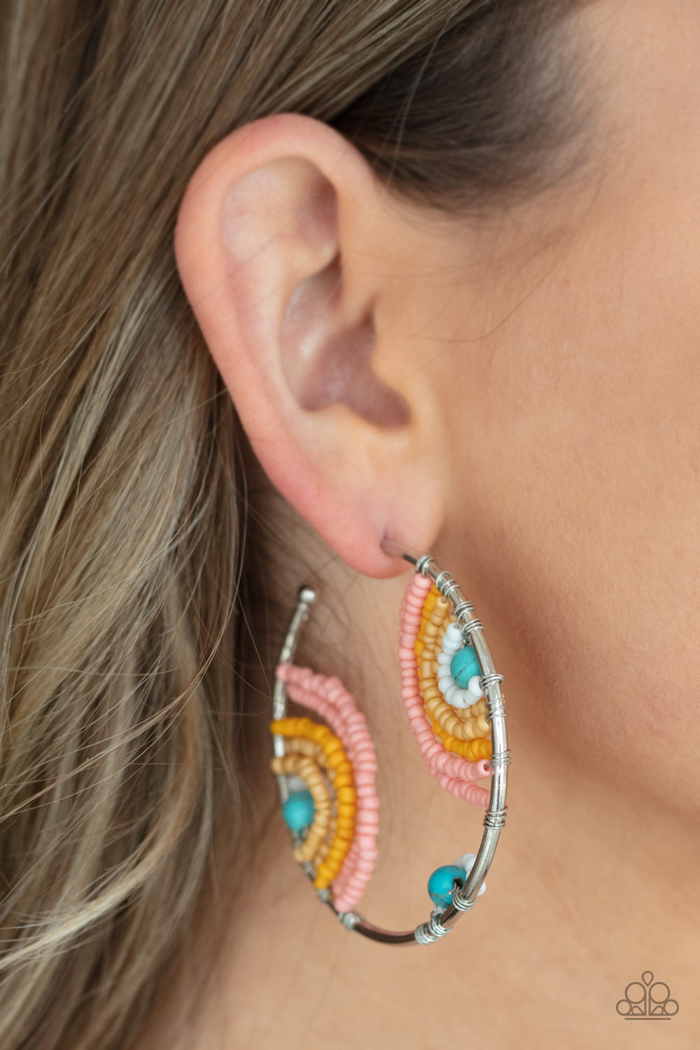 Rainbow Horizons Multi Hoop Earring - Paparazzi Accessories  Rows of white, Desert Mist, Marigold, and Burnt Coral seed beads curl around turquoise stone centers, creating colorful rainbows inside a delicate wire wrapped hoop. Hoop measures approximately 2" in diameter. Earring attaches to a standard post fitting.  All Paparazzi Accessories are lead free and nickel free!  Sold as one pair of hoop earrings.