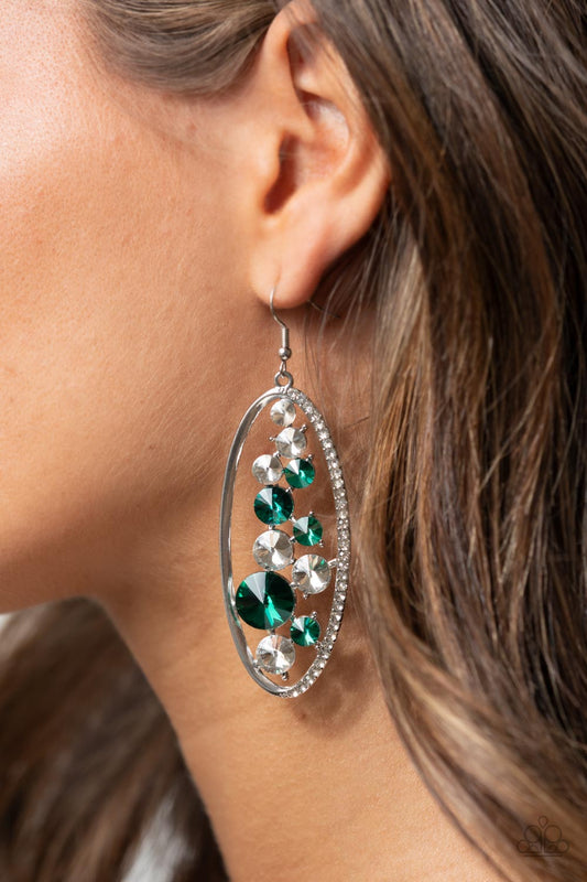 Rock Candy Bubbly Green Earring - Paparazzi Accessories  An oversized collection of glassy white and glittery green rhinestones sparkle inside a silver oval frame. One side of the frame is encrusted in dainty white rhinestones, adding a refined flair to the bubbly lure. Earring attaches to a standard fishhook fitting.  All Paparazzi Accessories are lead free and nickel free!  Sold as one pair of earrings.