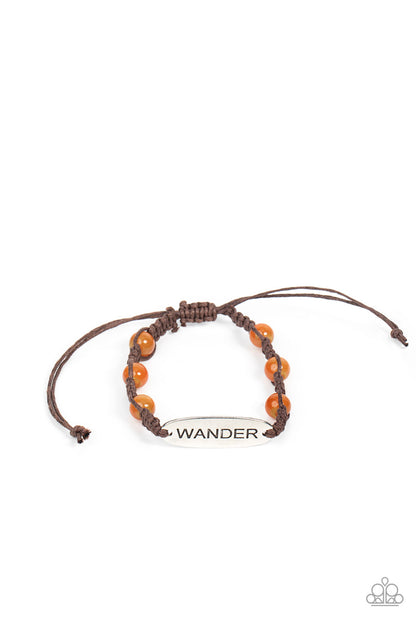 Roaming For Days Orange Urban Bracelet - Paparazzi Accessories  Glassy peach cat's eye stone beads are knotted in place along a strand of braided brown cording that attaches to a silver centerpiece stamped in the word, "Wander," for a free-spirited fashion. Features an adjustable sliding knot closure.  All Paparazzi Accessories are lead free and nickel free!  Sold as one individual bracelet.