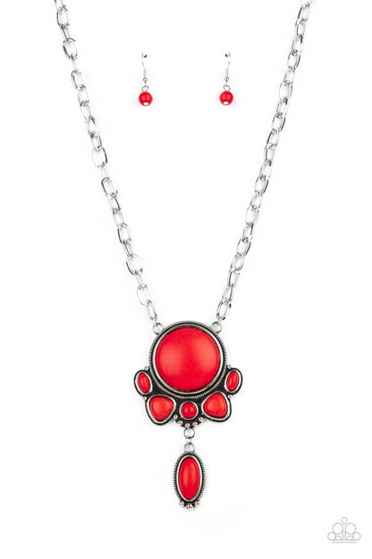 Geographically Gorgeous Red Necklace- Paparazzi Accessories  A large red stone encased in a studded silver frame swings dramatically from a heavy silver chain with oversized links. A collection of red stones wraps around the bottom of the large pendant, with an elongated oval stone swaying below them. Features an adjustable clasp closure.  Sold as one individual necklace. Includes one pair of matching earrings.  Get The Complete Look!  Bracelet: "Eco-Friendly Fashionista - Red" (Sold Separately)