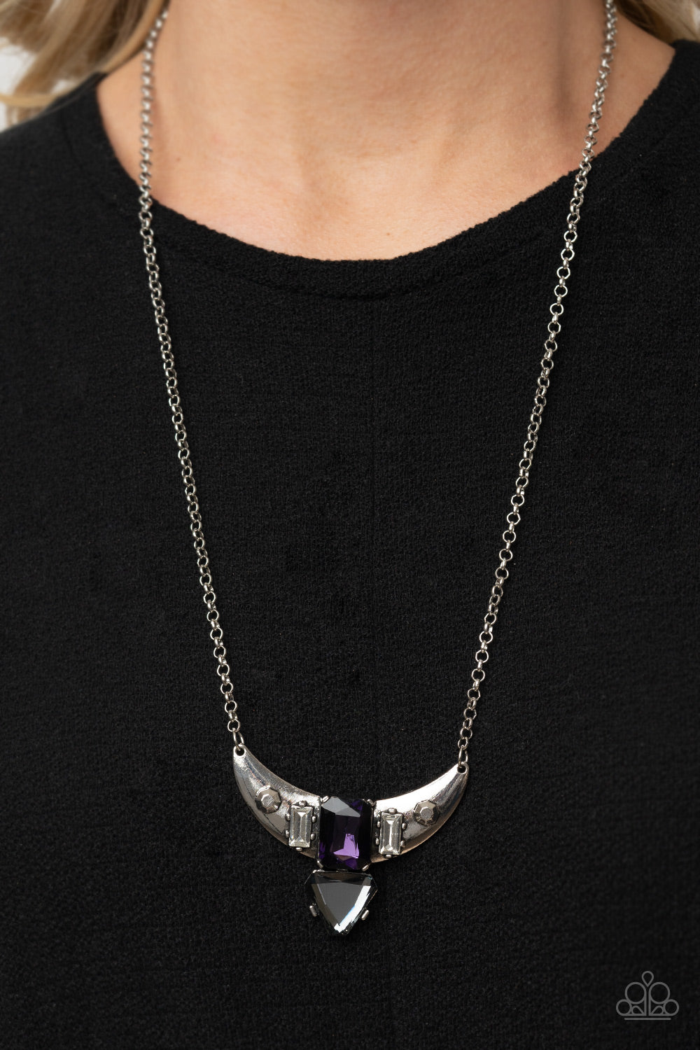 You the TALISMAN! Purple Necklace - Paparazzi Accessories  Pairs of faceted silver beads and glassy white emerald cut gems flank an oversized emerald cut purple gem atop an antiqued silver half moon frame. A smoky triangular cut gem adorns the bottom of the pendant, creating a twinkly talisman at the bottom of a classic silver chain. Features an adjustable clasp closure.  All Paparazzi Accessories are lead free and nickel free!  Sold as one individual necklace. Includes one pair of matching earrings.