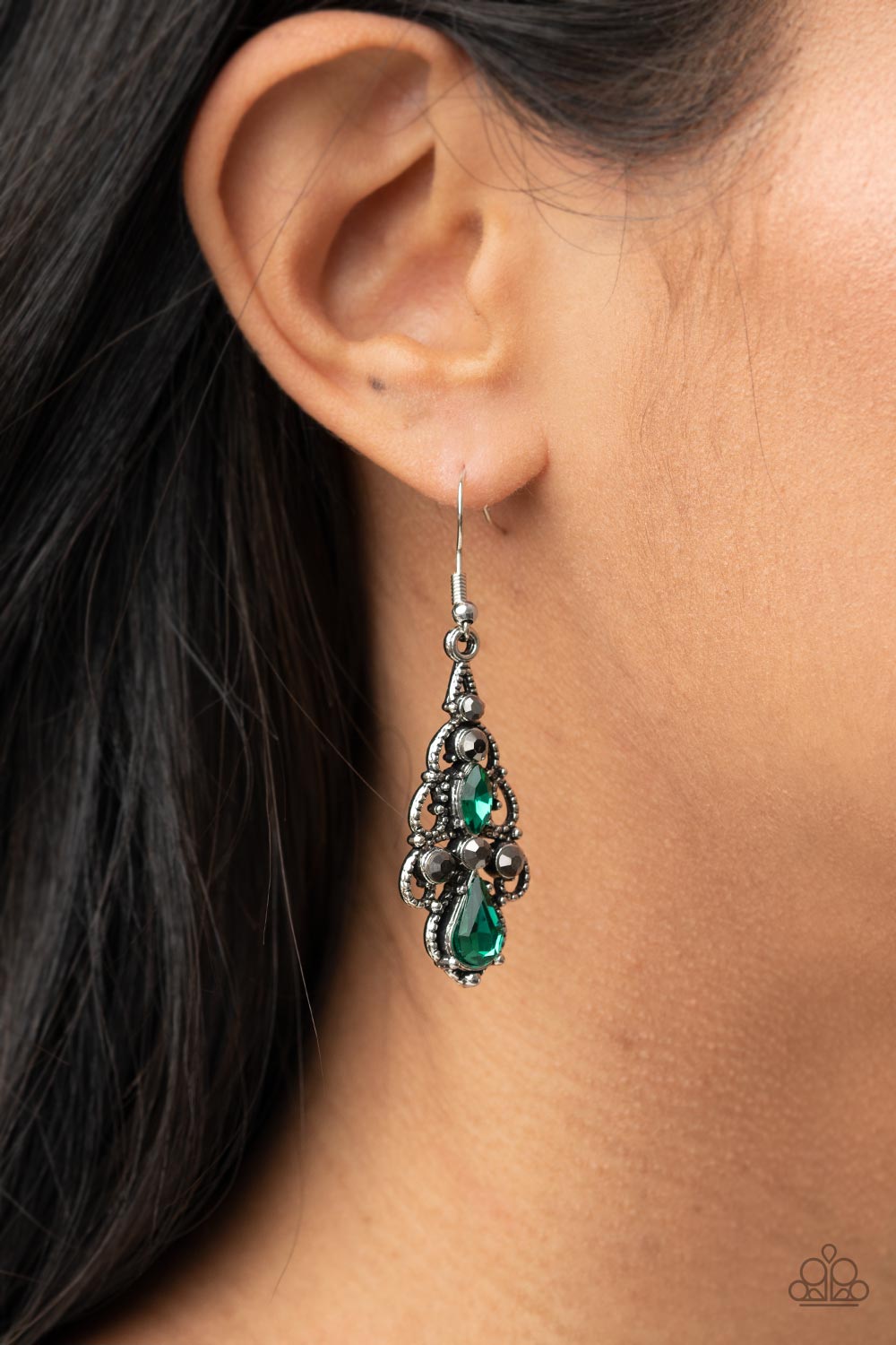 Urban Radiance Green Earring - Paparazzi Accessories  Embellished in mismatched green and hematite rhinestones, studded silver filigree swirls into an airy chandelier, creating a regal lure. Earring attaches to a standard fishhook fitting.  All Paparazzi Accessories are lead free and nickel free!  Sold as one pair of earrings.