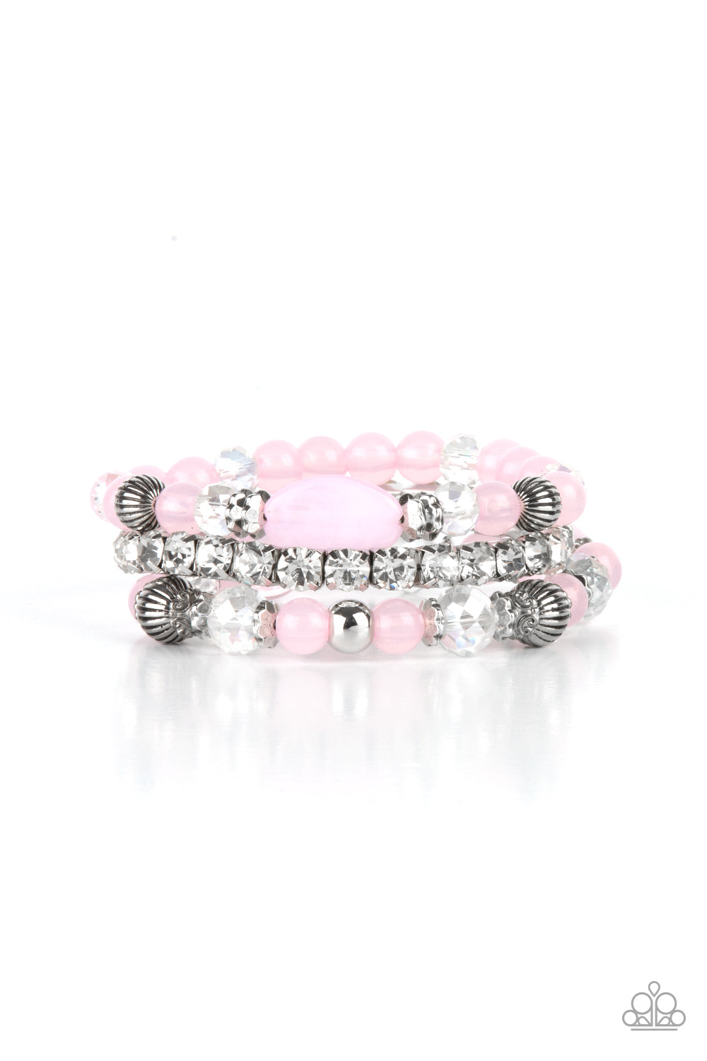 Ethereal Etiquette Pink Bracelet - Paparazzi Accessories  Infused with a stretchy strand of glassy white rhinestones, a mismatched collection of cloudy pink, white crystal-like, and ornate silver accents are threaded along stretchy bands around the wrist, creating ethereal layers.  All Paparazzi Accessories are lead free and nickel free!  Sold as one set of three bracelets.