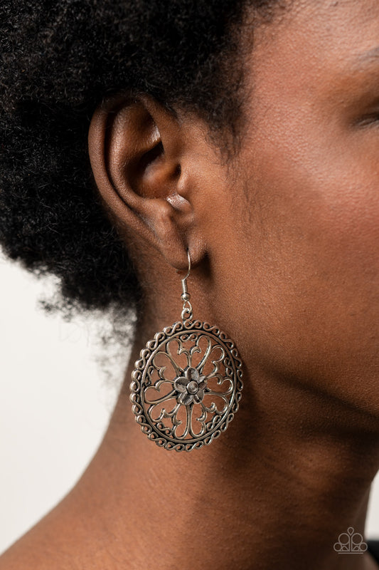 Floral Fortunes Silver Earring - Paparazzi Accessories. Airy butterfly shaped silver frames fan out from an antiqued silver flower, creating a whimsical centerpiece inside a hoop of dainty silver infinity accents. Earring attaches to a standard fishhook fitting.  ﻿All Paparazzi Accessories are lead free and nickel free!  Sold as one pair of earrings.