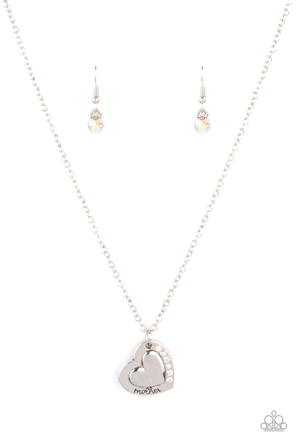 Happily Heartwarming White Necklace - Paparazzi Accessories  Stamped in the word, "Mother," an embossed heart pendant is encrusted in a row of white and iridescent rhinestones, creating a sparkly sentimental centerpiece below the collar. Features an adjustable clasp closure.  Sold as one individual necklace. Includes one pair of matching earrings.