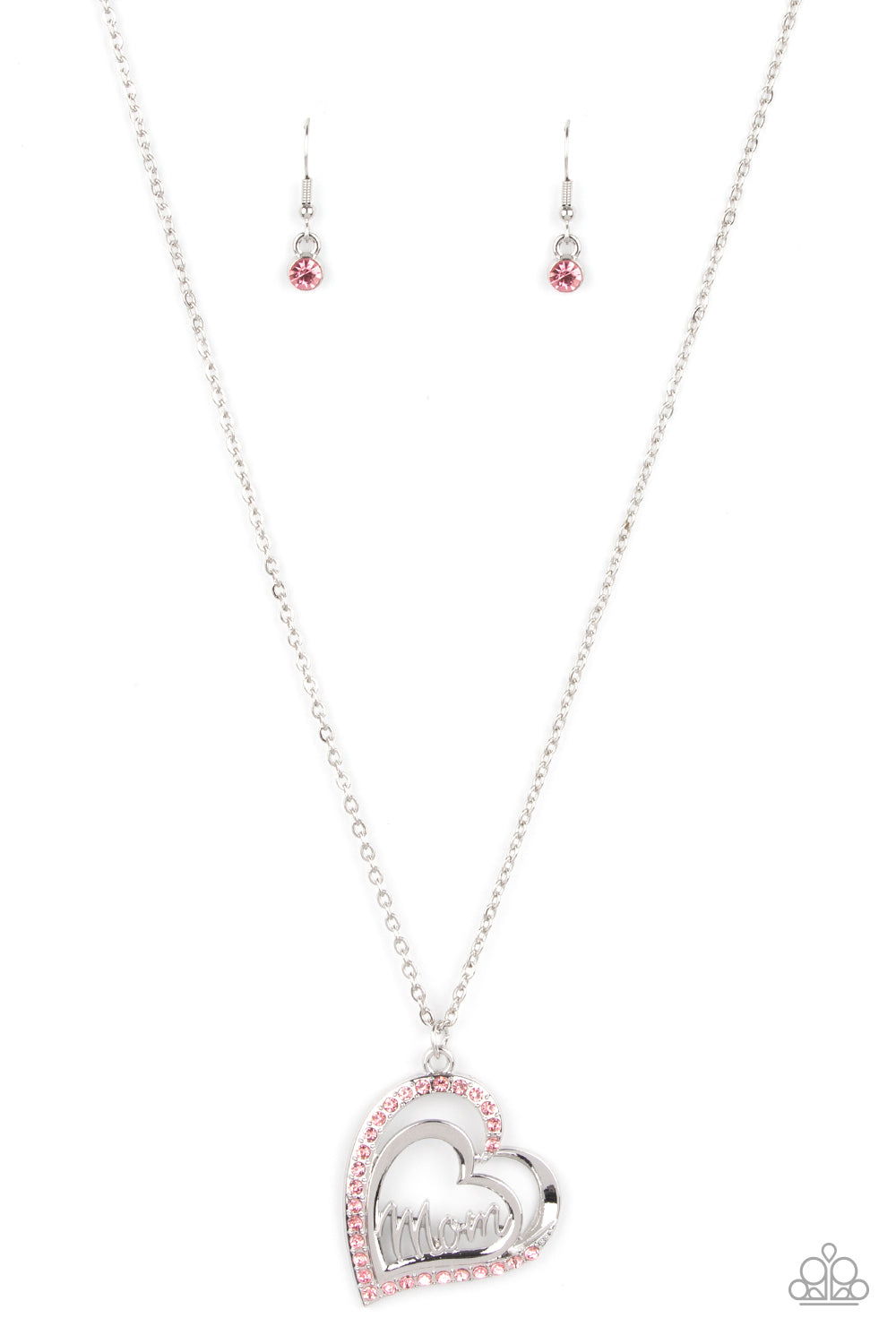 A Mothers Heart Pink Necklace - Paparazzi Accessories  The word "Mom" floats inside an airy heart-shaped frame. A second heart encrusted with brilliant pink rhinestones encircles the centerpiece as it sways from a lengthened silver chain for a sweet token of love. Features an adjustable clasp closure.  Sold as one individual necklace. Includes one pair of matching earrings.