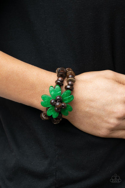 Tropical Flavor Green Bracelet - Paparazzi Accessories  Featuring heart-shaped petals, a bright green wooden flower sits atop double strands of wooden beads threaded along stretchy bands for a tropical flair atop the wrist.  Sold as one individual bracelet.