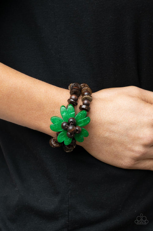 Tropical Flavor Green Bracelet - Paparazzi Accessories  Featuring heart-shaped petals, a bright green wooden flower sits atop double strands of wooden beads threaded along stretchy bands for a tropical flair atop the wrist.  Sold as one individual bracelet.