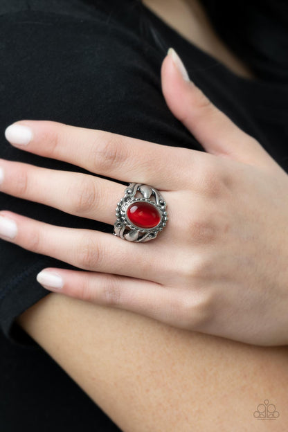 Jubilant Gem Red Ring - Paparazzi Accessories  A polished red cat's eye stone creates a jubilant statement as it rests inside a studded silver frame atop an airy pedestal like band. Features a stretchy band for a flexible fit.  Sold as one individual ring.