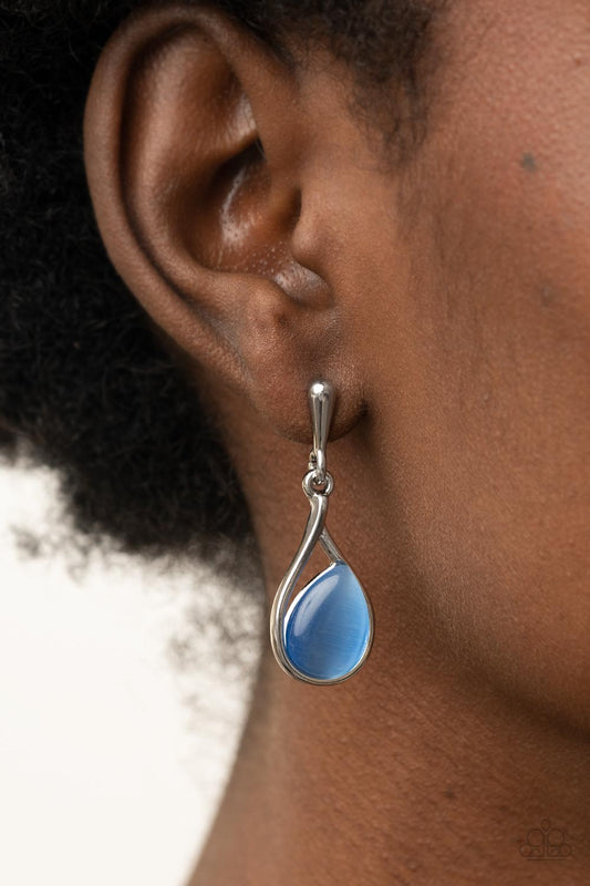 Pampered Glow Up Blue Post Earring - Paparazzi Accessories  A glowing blue cat's eye stone sits askance in a simple silver teardrop frame as it dangles from a solid silver bulb creating a polished finish. Earring attaches to a standard post fitting.  Sold as one pair of post earrings.