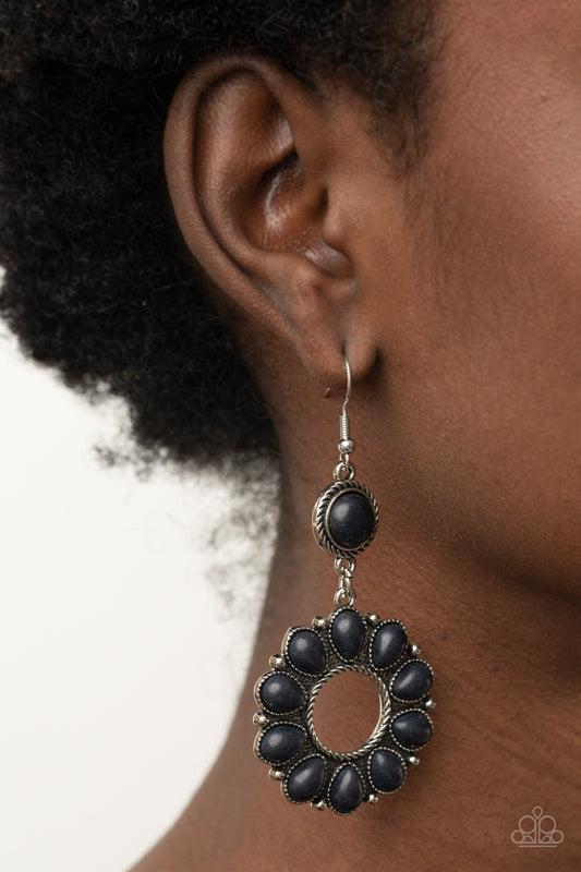 Back At The Ranch Black Earring - Paparazzi Accessories  An earthy collection of black teardrop stones fans out from a textured silver ring, creating a scalloped floral frame dangling from a round black stone encased in a braided silver fitting. Earring attaches to a standard fishhook fitting.  Sold as one pair of earrings.