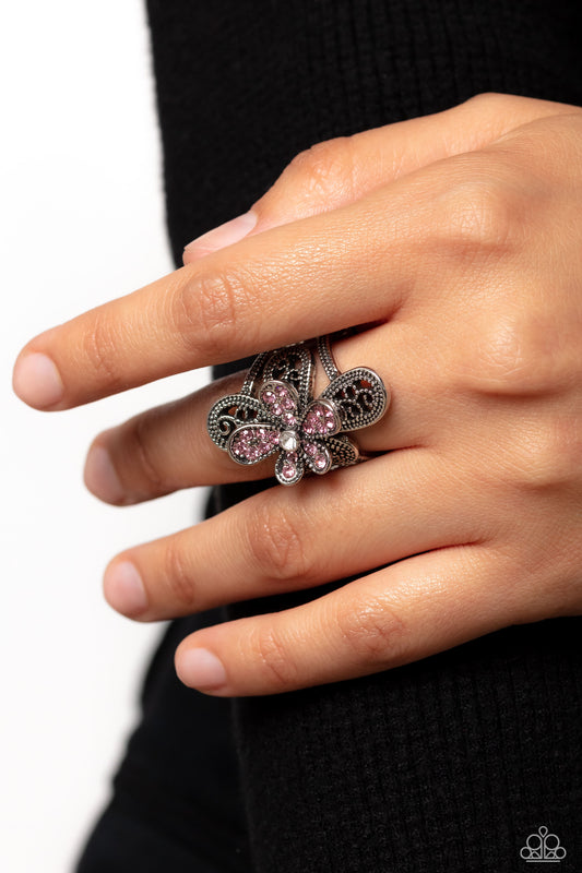 Garden Escapade Pink Ring - Paparazzi Accessories  Dotted with a dainty white rhinestone center, silver petals overlaid with glittery pink rhinestones, sit atop studded silver filigree petals, creating a frilly floral centerpiece atop the finger. Features a stretchy band for a flexible fit.  Sold as one individual ring.  P4RE-PKXX-224XX