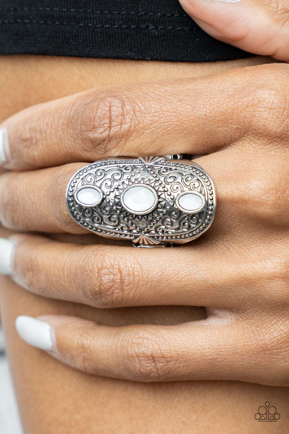 Promenade Paradise White Ring - Paparazzi Accessories  A trio of opaque white oval beads encased in silver frames graces the top of an elaborately decorated silver band. Dotted texture and floral designs create a statement-making finish atop the finger. Features a stretchy band for a flexible fit.  All Paparazzi Accessories are lead free and nickel free!  Sold as one individual ring.