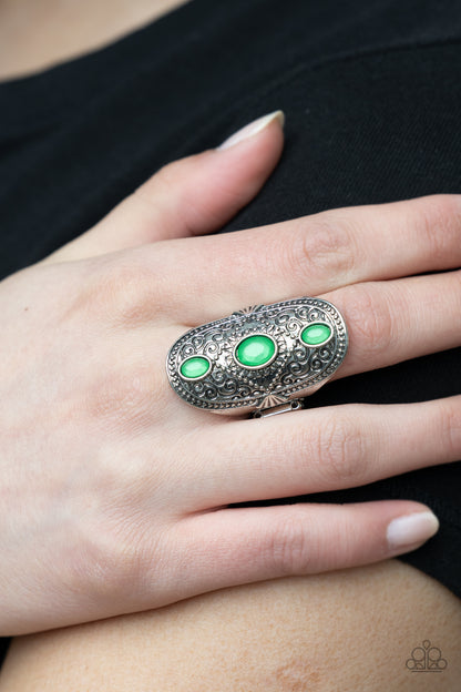 Promenade Paradise Green Ring - Paparazzi Accessories  A trio of opaque Mint oval beads encased in silver frames graces the top of an elaborately decorated silver band. Dotted texture and floral designs create a statement-making finish atop the finger. Features a stretchy band for a flexible fit.  All Paparazzi Accessories are lead free and nickel free!  Sold as one individual ring.