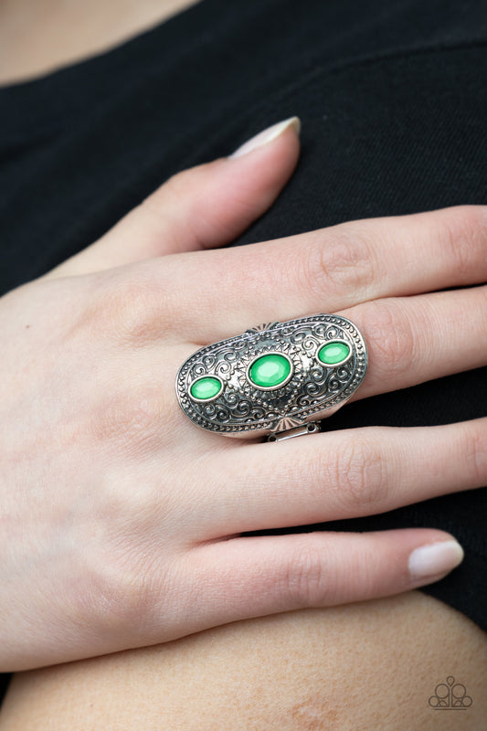 Promenade Paradise Green Ring - Paparazzi Accessories  A trio of opaque Mint oval beads encased in silver frames graces the top of an elaborately decorated silver band. Dotted texture and floral designs create a statement-making finish atop the finger. Features a stretchy band for a flexible fit.  All Paparazzi Accessories are lead free and nickel free!  Sold as one individual ring.