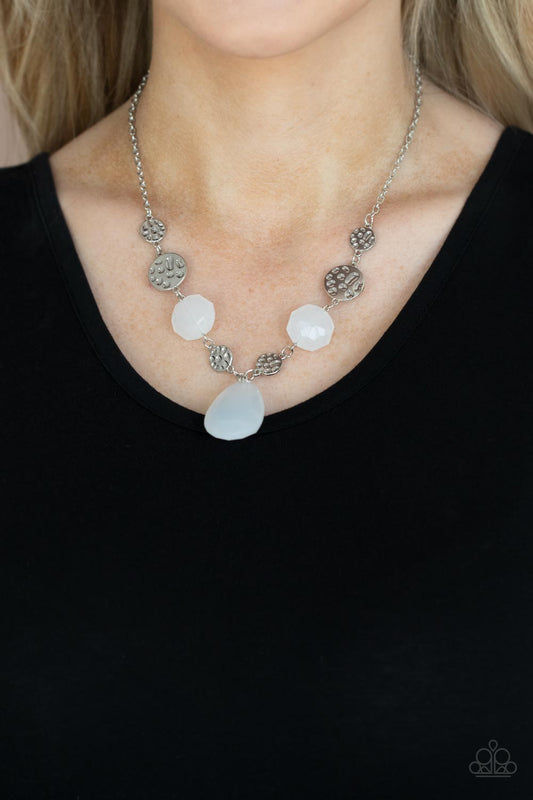 DEW What You Wanna DEW White Necklace - Paparazzi Accessories  A dewy white teardrop swings from the bottom of interlinking hammered silver discs and matching dewy white crystal-like beads, creating a dreamy display below the collar. Features an adjustable clasp closure.  Sold as one individual necklace. Includes one pair of matching earrings.