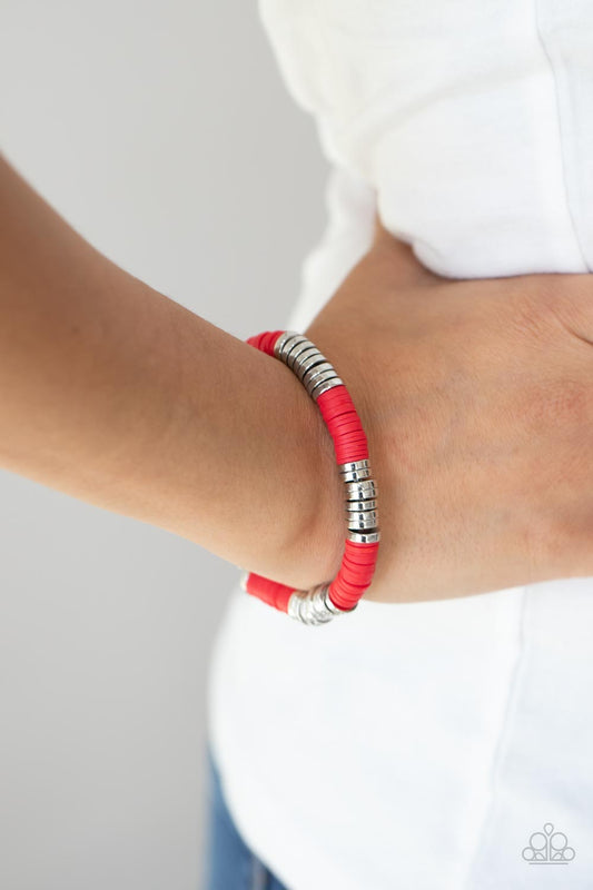 Stacked In Your Favor Red Bracelet - Paparazzi Accessories  Stacks of rubbery red discs and bold silver rings are threaded along a stretchy band around the wrist, creating a versatile pop of color.  All Paparazzi Accessories are lead free and nickel free!  Sold as one individual bracelet.