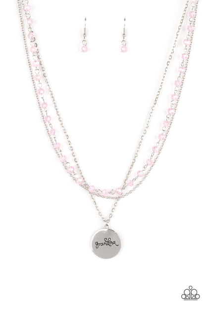 Promoted to Grandma Pink Necklace - Paparazzi Accessories  Infused with a strand of iridescent pink crystal-like beads, two dainty rows of mismatched silver chains delicately layer below the collar. Stamped in the word, "Grandma," a shiny silver disc swings from the lowest chain, creating a loving pendant. Features an adjustable clasp closure.  Sold as one individual necklace. Includes one pair of matching earrings.