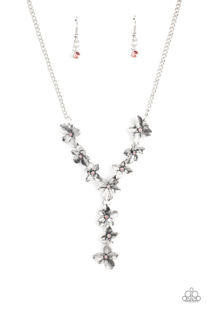 Fairytale Meadow Pink Necklace - Paparazzi Accessories  Dotted with dainty pink rhinestone centers, whimsical silver flowers delicately link into an extended pendant below the collar for an ethereal fashion. Features an adjustable clasp closure.  Sold as one individual necklace. Includes one pair of matching earrings.