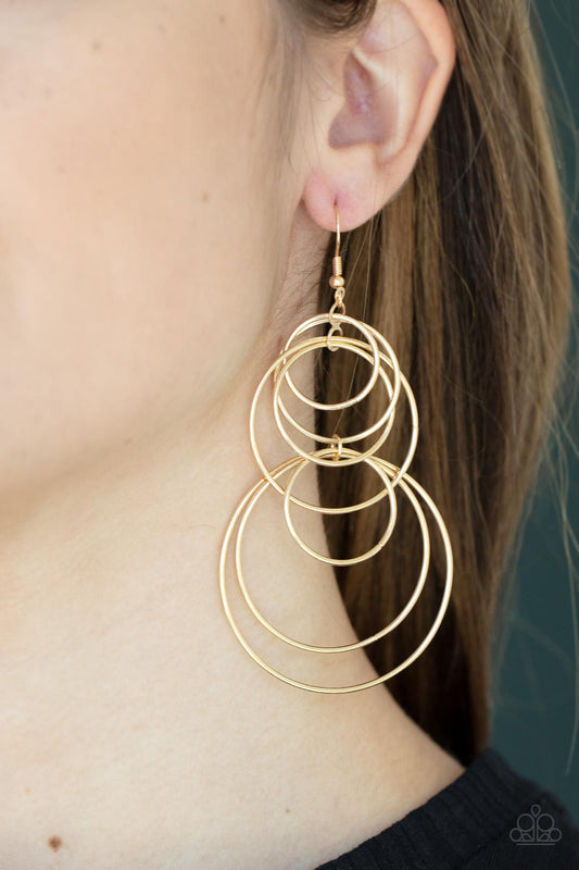 I Feel Dizzy Gold Earring - Paparazzi Accessories  Varying in size, a shiny collection of mismatched gold hoops haphazardly connect into a dizzying lure. Earring attaches to a standard fishhook fitting.  Sold as one pair of earrings.