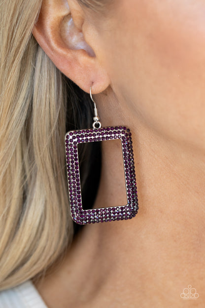 World FRAME-ous Purple Earring - Paparazzi Accessories  Bordered in rows of glittery purple rhinestones, an oversized silver rectangular frame swings from the ear for a fashionable finish. Earring attaches to a standard fishhook fitting.  All Paparazzi Accessories are lead free and nickel free!  Sold as one pair of earrings.