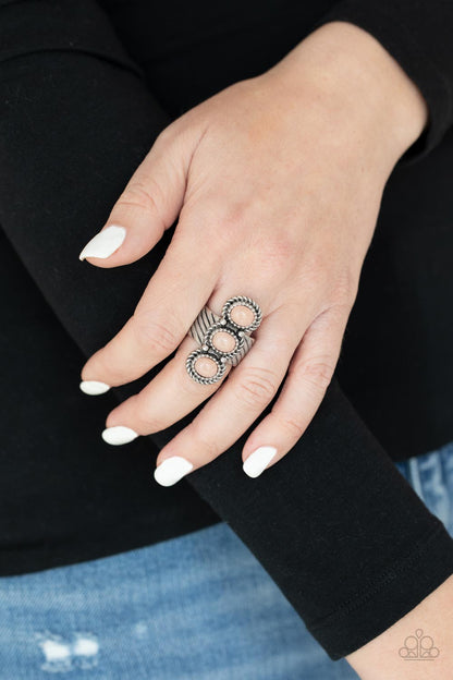 Peaceful Paradise Pink Ring - Paparazzi Accessories  A trio of asymmetrical rose quartz stones stack vertically across a linear textured silver band, creating a seasonal centerpiece atop the finger. Features a stretchy band for a flexible fit.  All Paparazzi Accessories are lead free and nickel free!  Sold as one individual ring.