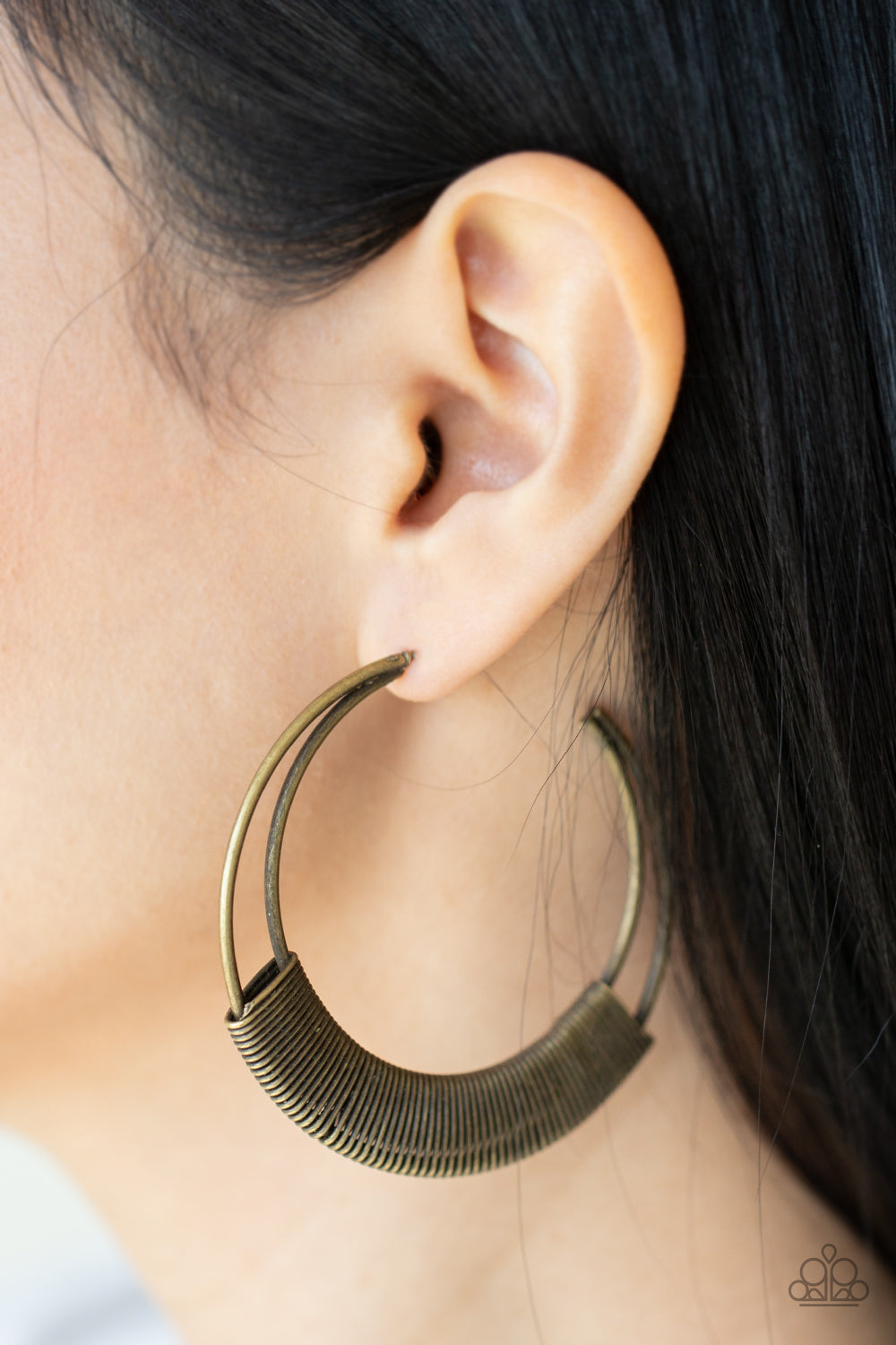Artisan Attitude Brass Earring - Paparazzi Accessories  Gritty brass wire delicately wraps around the bottoms of two curving bars that coalesce into an antiqued crescent, creating a rustic hoop. Earring attaches to a standard post fitting. Hoop measures approximately 2 1/2" in diameter.  Sold as one pair of hoop earrings.