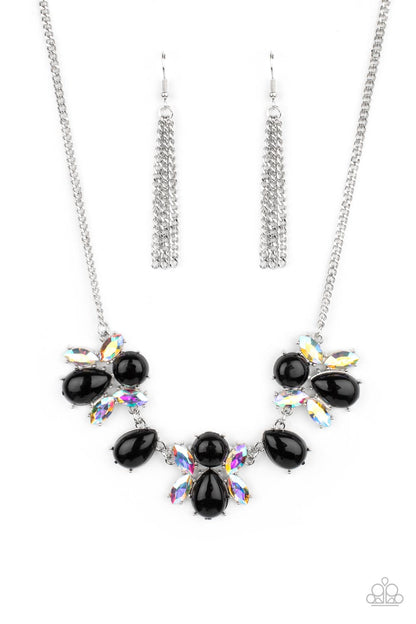 Galaxy Gallery Black Necklace - Paparazzi Accessories  A bubbly collection of round and teardrop black beads coalesce with iridescent marquise cut rhinestones below the collar, creating a stellar centerpiece. Features an adjustable clasp closure.  Sold as one individual necklace. Includes one pair of matching earrings.