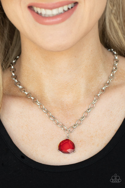 Gallery Gem Red Necklace - Paparazzi Accessories  An oversized glassy red gem is pressed into a pronged silver fitting at the bottom of a chunky silver chain, creating a dramatic pendant below the collar. Features an adjustable clasp closure.  All Paparazzi Accessories are lead free and nickel free!  Sold as one individual necklace. Includes one pair of matching earrings.