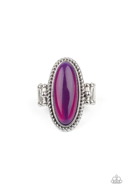 Oval Oasis Purple Ring - Paparazzi Accessories  Featuring a glassy iridescence, an oval purple acrylic bead is pressed into the center of textured silver fittings, creating a mystical centerpiece atop the finger. Features a dainty stretchy band for a flexible fit.  Sold as one individual ring.