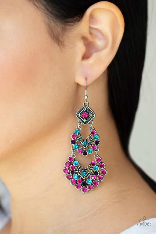 All For The GLAM Multi Earring - Paparazzi Accessories  A glittery explosion of multicolored rhinestones coalesce into three sparkly frames that delicately link into a studded chandelier, creating a dramatic statement piece. Earring attaches to a standard fishhook fitting.  Sold as one pair of earrings.