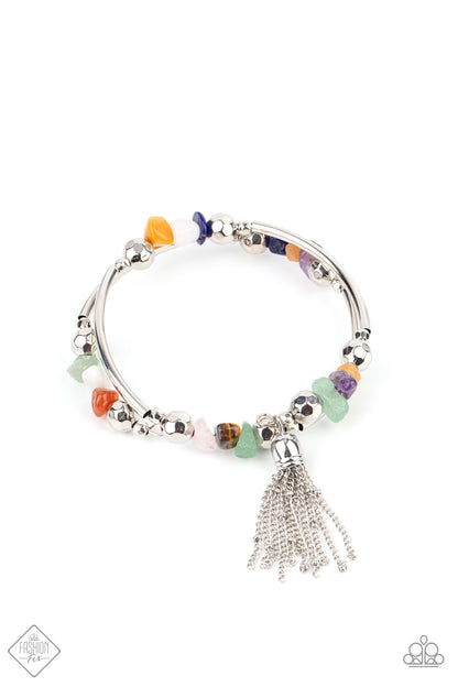 Mineral Mosaic Multi Bracelet - Paparazzi Accessories  An earthy collection of faceted silver beads, raw cut multicolored rock beads, and cylindrical silver accents are threaded along a coiled wire around the wrist for a grounding pop of color. A shimmery silver chain tassel swings from one end of the spiral, adding a hint of flirtatious movement to the piece.  All Paparazzi Accessories are lead free and nickel free!  Sold as one individual bracelet.