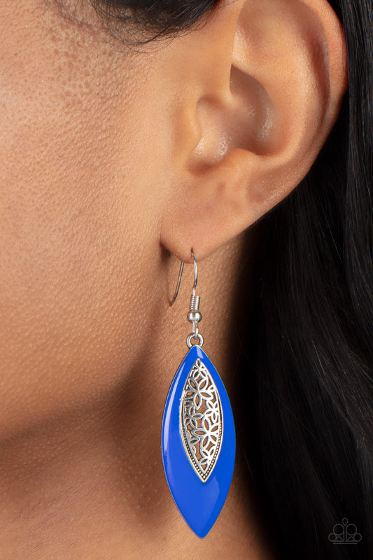 Venetian Vanity Blue Earring - Paparazzi Accessories  Asymmetrically bordered in a bright Mykonos Blue frame, airy silver filigree blooms along the center of a colorful lure for a seasonal flair. Earring attaches to a standard fishhook fitting.  All Paparazzi Accessories are lead free and nickel free!  Sold as one pair of earrings.