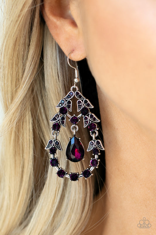 Garden Decorum - Purple Item #P5RE-PRXX-163XX A solitaire purple teardrop rhinestone swings from the top of an ornately hinged teardrop frame adorned in purple rhinestone dotted leafy silver frames, creating a glamorous centerpiece. Earring attaches to a standard fishhook fitting.  Sold as one pair of earrings.