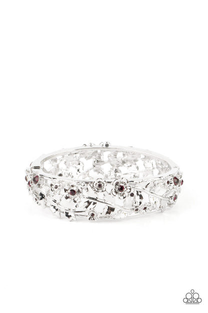 Ripe for the Picking Purple Hinge Bracelet - Paparazzi Accessories  Dotted with dainty purple rhinestone centers, flowering leafy silver vines bloom into two oversized silver frames that delicately hinge into a versatile bangle-like bracelet. Features a hinged closure.  All Paparazzi Accessories are lead free and nickel free!  Sold as one individual bracelet.