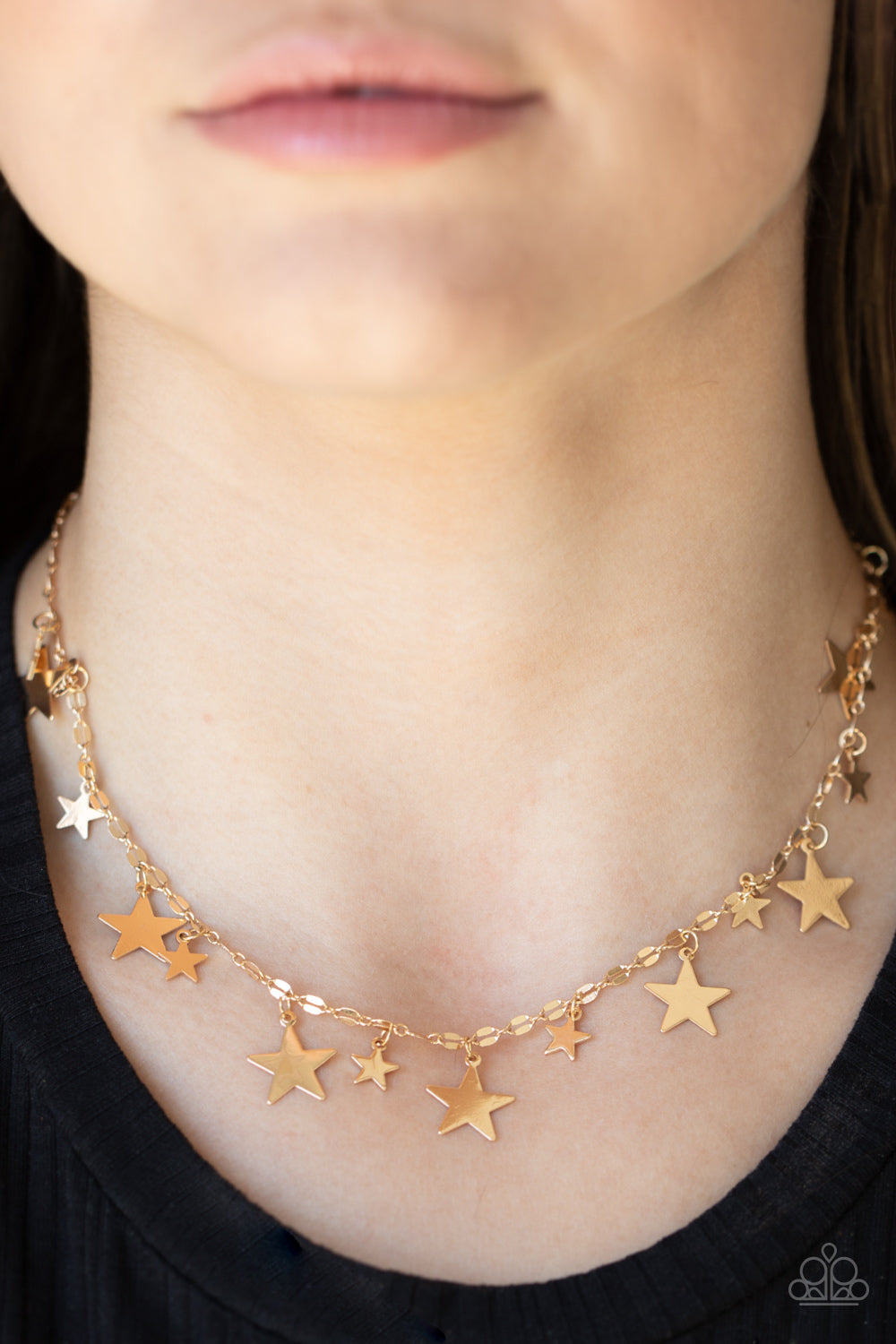 Starry Shindig Gold Necklace - Paparazzi Accessories  Varying in size, dainty shiny gold stars alternate along decorative gold chain, creating a stellar fringe below the collar. Features an adjustable clasp closure.  All Paparazzi Accessories are lead free and nickel free!   Sold as one individual necklace. Includes one pair of matching earrings.