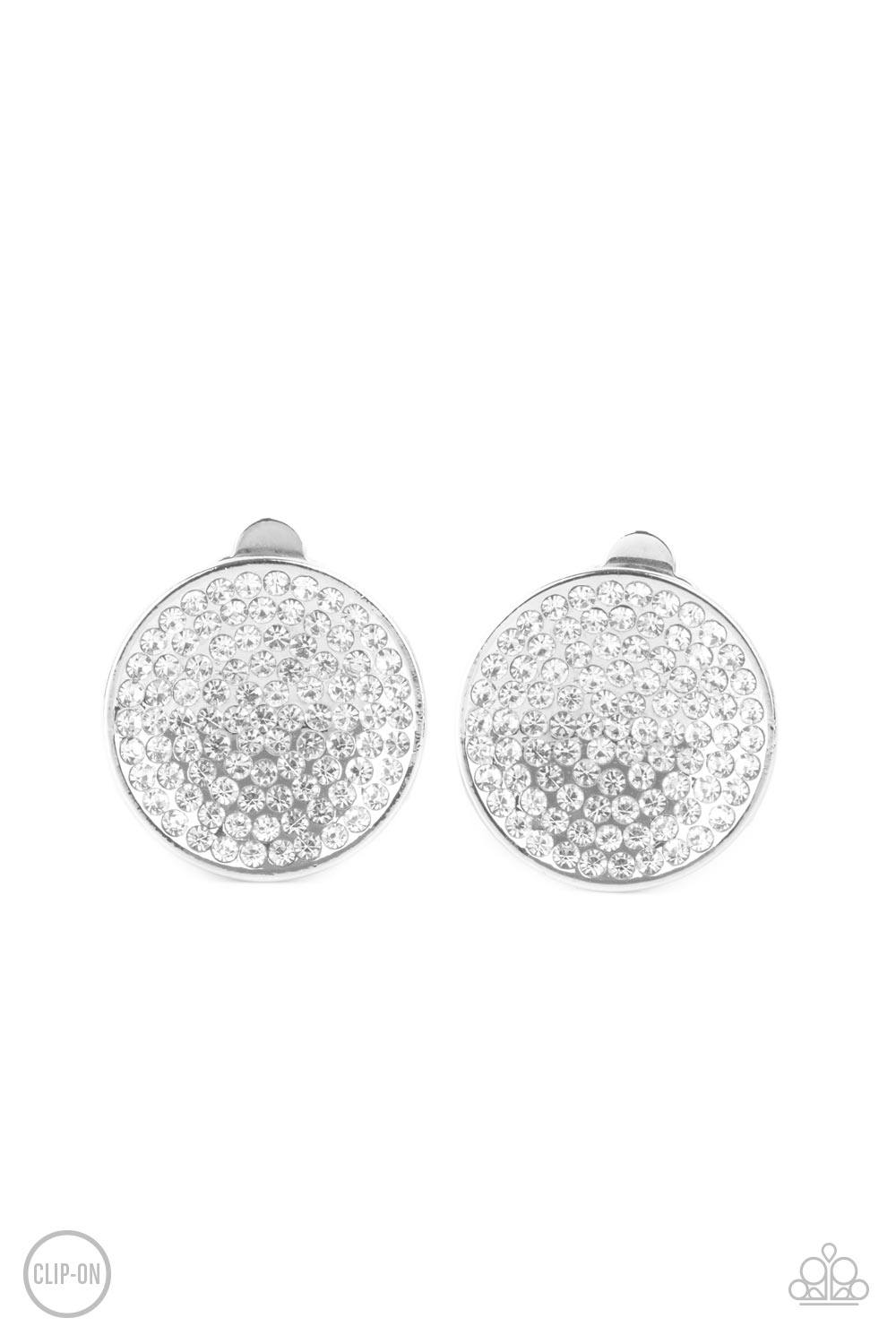 Drama on Demand White Clip-On Earring - Paparazzi Accessories  Sparkling with brilliance, a concave shiny silver disc encompasses radiating rows of shimmering white rhinestones creating a striking impact. Earring attaches to a standard clip-on fitting.  Sold as one pair of clip-on earrings.