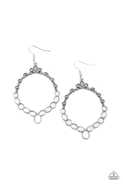 Thai Treasures White Earring - Paparazzi Accessories  Ornate floral motifs decorate the top half of an airy circular silver frame. A row of dewy white oval and round beads creates a border along the lower half of the frame, culminating in a single teardrop accent for a demurely enchanting lure. Earring attaches to a standard fishhook fitting.  Sold as one pair of earrings.