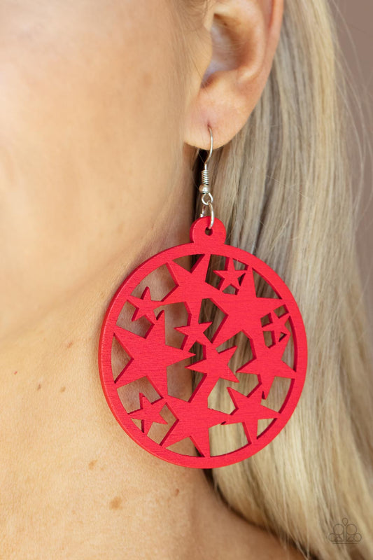 Cosmic Paradise Red Wooden Earring - Paparazzi Accessories  An oversized round red wooden frame is filled with a cosmos of cut-out red stars creating a whimsical statement. Earring attaches to a standard fishhook fitting.  Sold as one pair of earrings.
