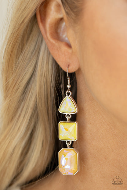 Cosmic Culture Yellow Earring - Paparazzi Accessories  Featuring a yellow UV shimmer, a trio of geometrically shaped gems pressed into silver frames link together culminating in a cosmically stellar lure. Earring attaches to a standard fishhook fitting.  Sold as one pair of earrings.