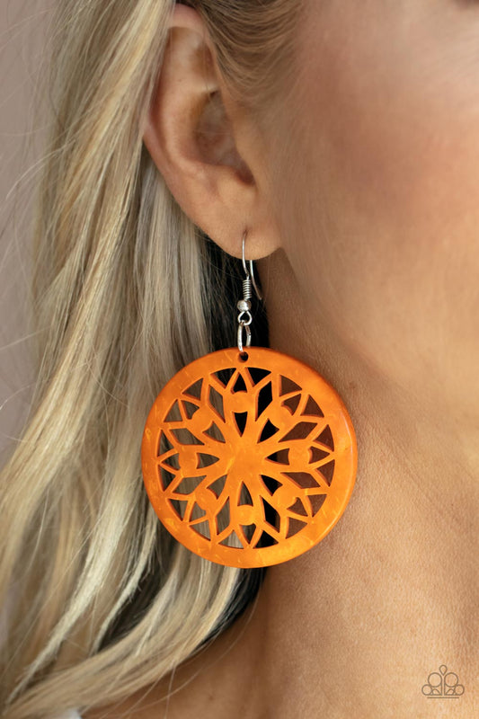Ocean Canopy - Orange Item #P5SE-OGXX-170XX A bold mandala-inspired design is carved out of an oversized orange disc creating an eye-catching statement. Earring attaches to a standard fishhook fitting.  Sold as one pair of earrings.