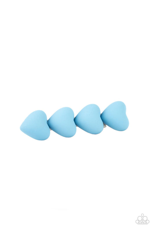 HEART to Please Blue Hair Clip - Paparazzi Accessories  Featuring a rubbery matte finish, a bubbly row of blue hearts stack into a flirtatious centerpiece. Features a standard hair clip on the back.  Sold as one individual hair clip.
