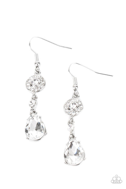 Graceful Glimmer White Earring - Paparazzi Accessories  A silver frame dotted in glassy white rhinestones, a solitaire white rhinestone, and an oversized white teardrop gem delicately link into a graceful lure. Earring attaches to a standard fishhook fitting.  All Paparazzi Accessories are lead free and nickel free!   Sold as one pair of earrings.